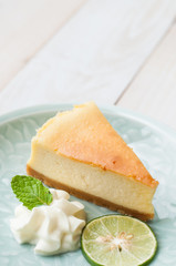 new york cheesecake on white wooden board