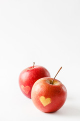 Red apples with a heart symbol