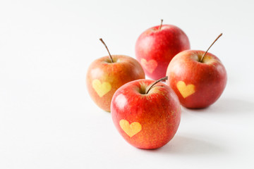 Red apples with a heart symbol