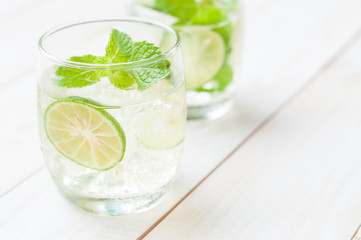Two fresh mojitos cocktail. Mojitos with mint leaves, lime