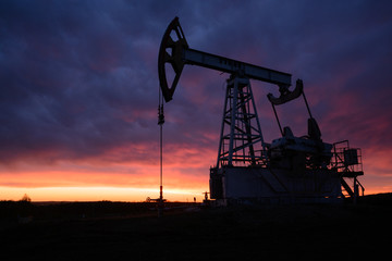 Oil pumping station at sunset