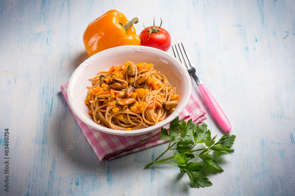 Poster pasta with mussel capsicum and tomato sauce