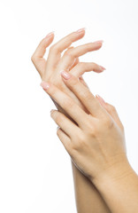 Woman rubs hand cream, makes a hand massage