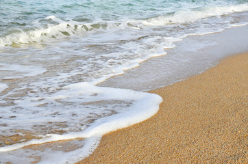 Fototapeta na wymiar Wave of the sea on the sand beach/ Close up image 