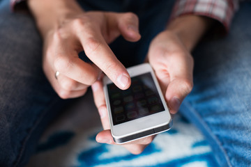 Close up of a man using mobile smart phone