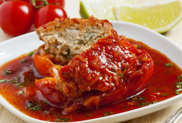 Bell peppers stuffed with meat, rice  and sauce on plate, select