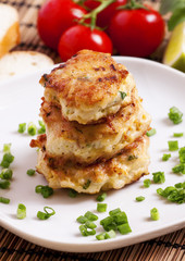 Homemade chicken cutlets sprinkled with green onion, selective f
