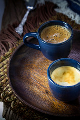 Obraz na płótnie Canvas Two blue cups of espresso on wooden plate