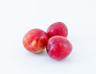 Red plum fruit isolated on white background
