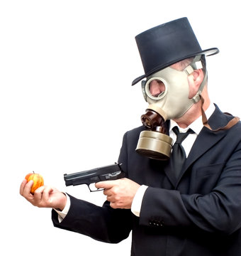 Businessman with gas mask and with a hat that is pointing with a