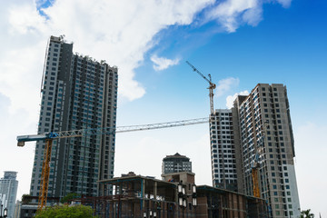 Fototapeta na wymiar tower crane on buildings under construction