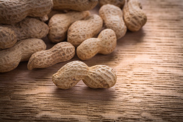 big pile peanuts on wooden board food and drink concept