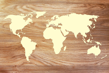 Fototapeta na wymiar World map outline on wood texture