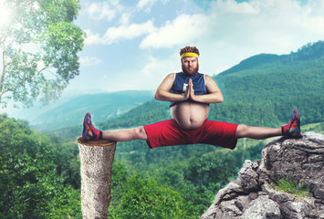 Overweight man doing splits