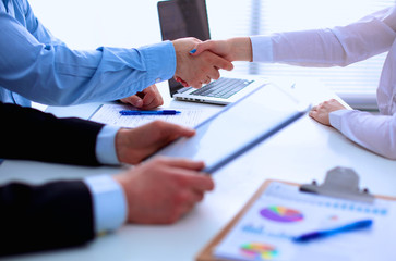 Business people shaking hands, finishing up a meeting