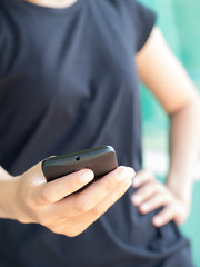 Close up of a woman using smart phone