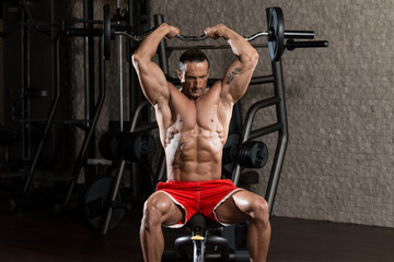 Fototapeta na wymiar Mature Man Working Out Triceps