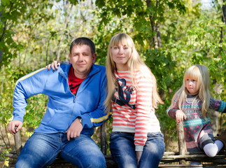 Portrait of Small Family in Forest