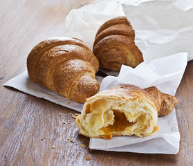 fresh croissants with apricot jam for breakfast