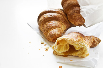 Fresh croissants on white background