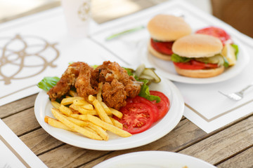 fast food hamburger and chicken fried potato