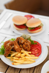 fast food hamburger and chicken fried potato