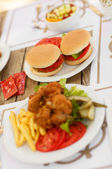 fast food hamburger and chicken fried potato