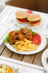 fast food hamburger and chicken fried potato