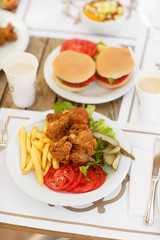 fast food hamburger and chicken fried potato