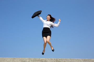 Successful business woman jump