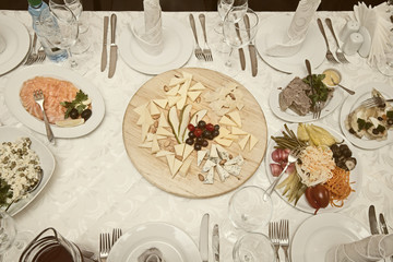 Banquet table with the dishes in the restaurant