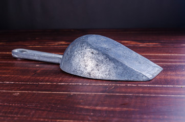 old scoop on wooden table background
