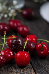 Fresh clean organic ripe cherries ion wooden table