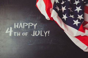 Fototapeta na wymiar 4th of july background with chalkboard and USA flag