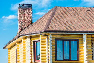 house with a gable roof window