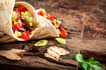 Vegetarian tortilla on rustic background