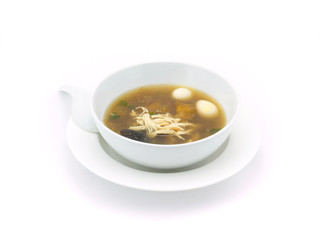 Fish maw soup in white bowl on white background