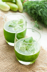 green smoothies on a brown background