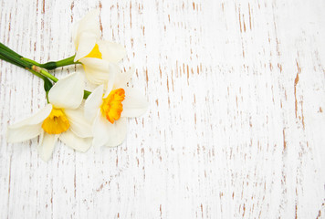 Daffodils on a wooden background