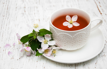 Cup of tea and spring blossom