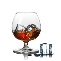 whiskey with ice in glass isolated on white background