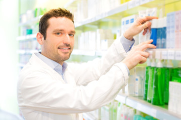 Attractive pharmacist clean the store up