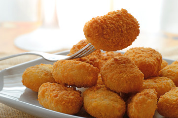 chicken nuggets served in a white bowl