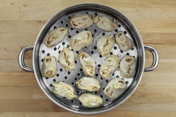 dumpling ready to be loaded in steamer 