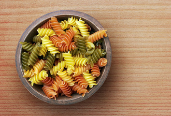 Pasta in wooden bowl