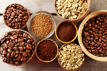 Various of coffee in small dishes on wooden table, top view