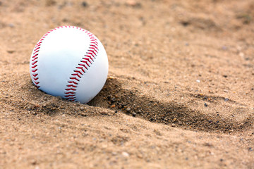 Baseball ball on sand