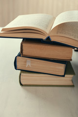 Stack of books on table close up