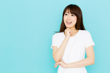 Obraz premium attractive asian nurse on blue background