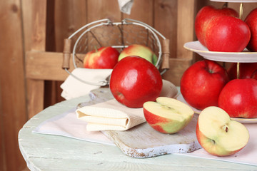Tasty ripe apples on serving tray on table close up